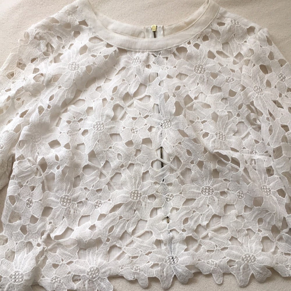 White floral cut out shirt.